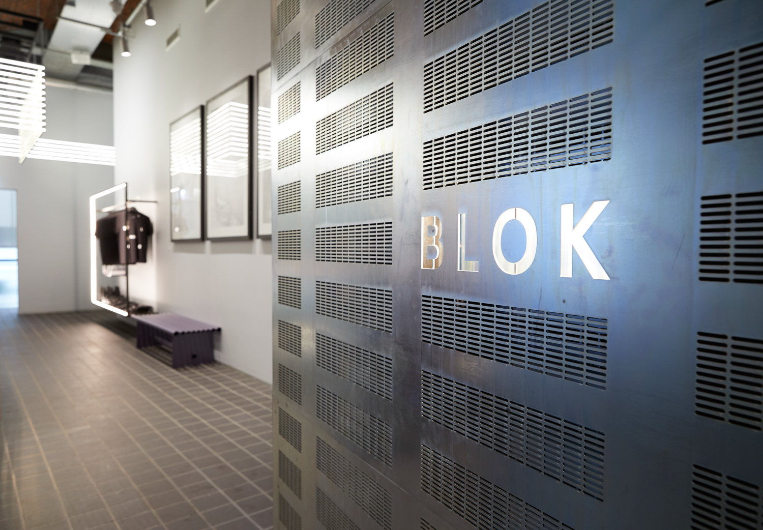 Entrance Portal, Close up of passivated steel panels and signage.
