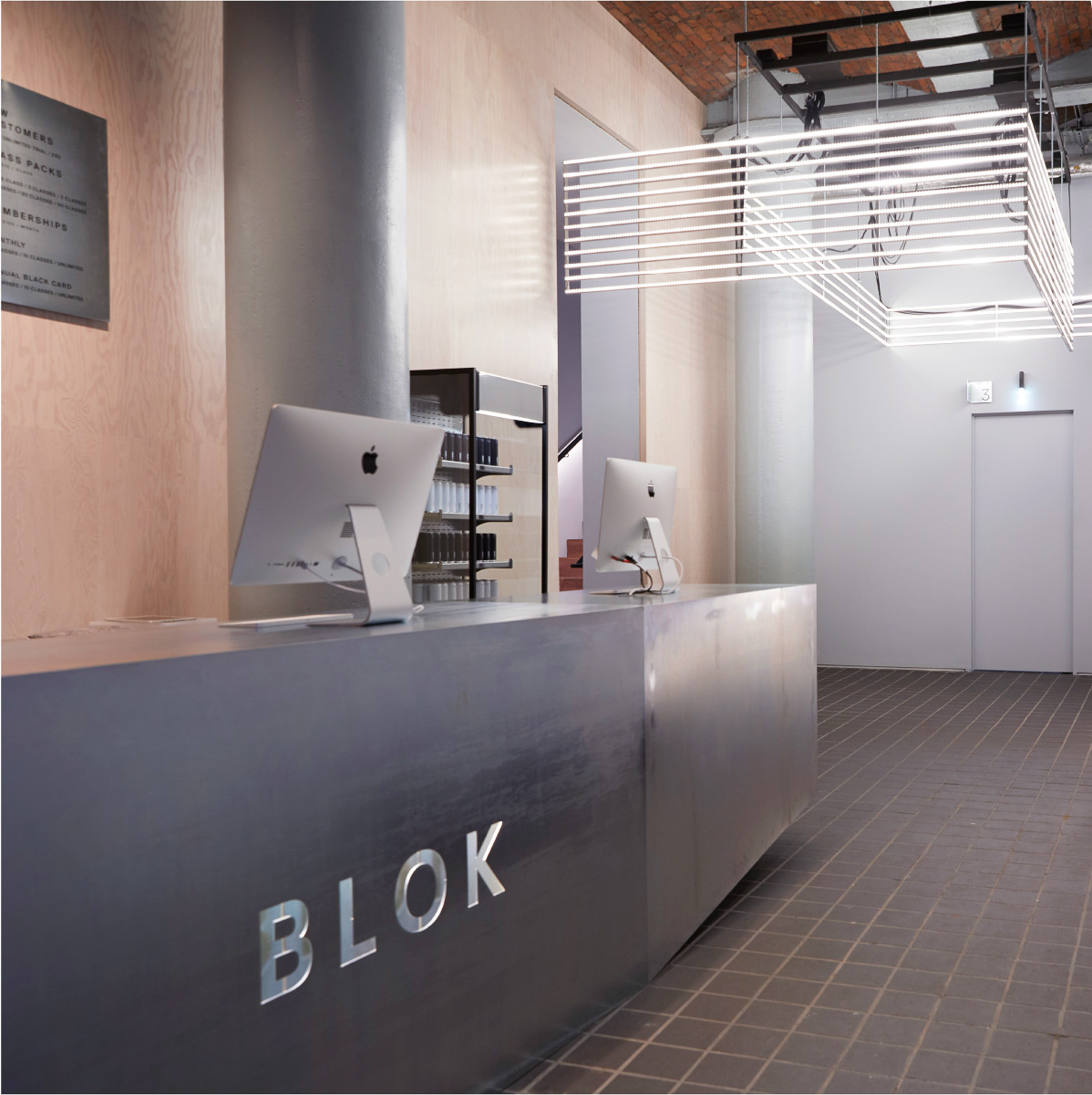 Reception Desk, 3.5m passivated mild steel desk cantilevered with custom grey valchromat cabinets.
