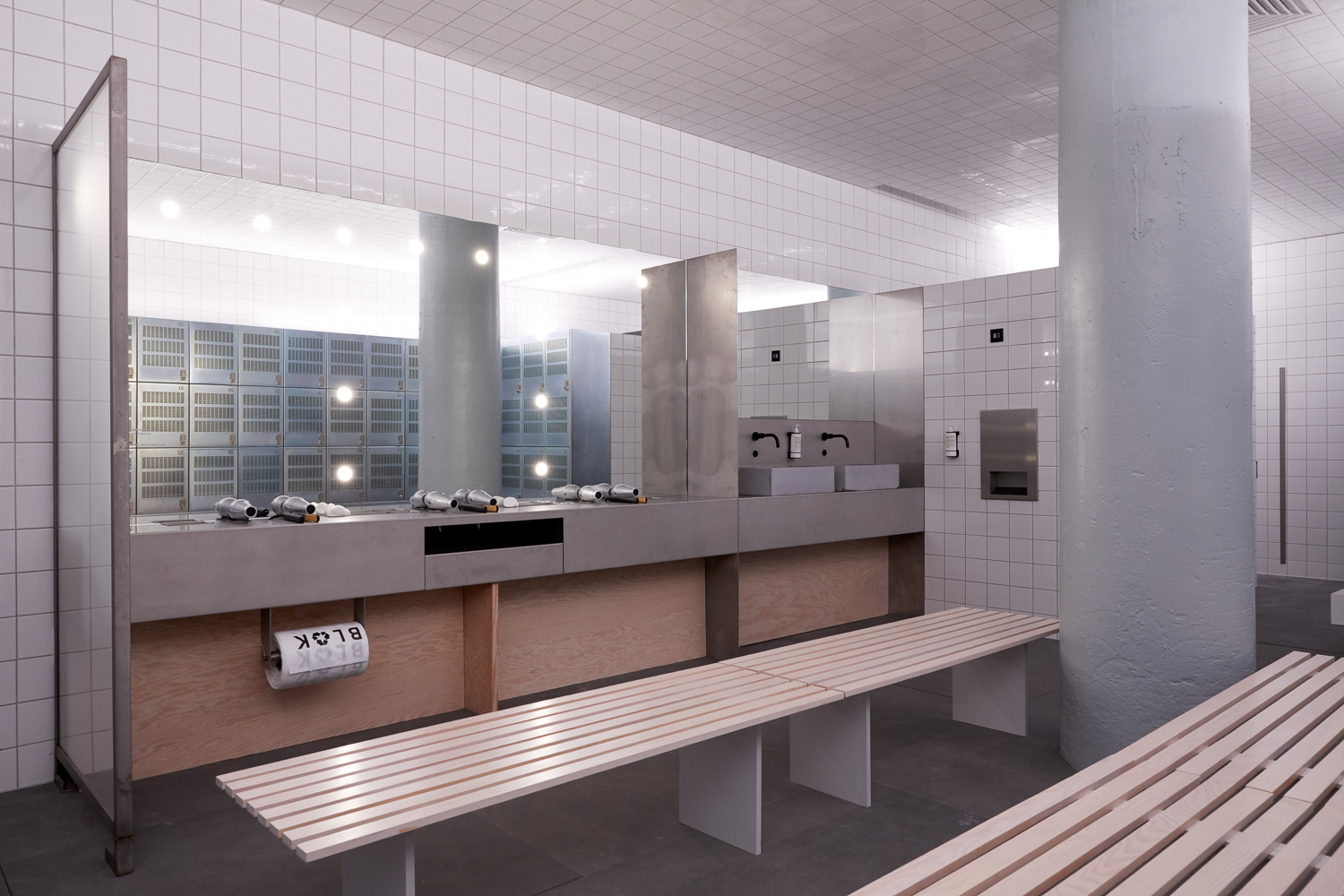 FEMALE CHANGING ROOM, Mild steel plate powder coated with douglas fir slats free standing benches. Folded stainless steel changing and sink counters with dividers custom inserts and custom bag dispenser.
