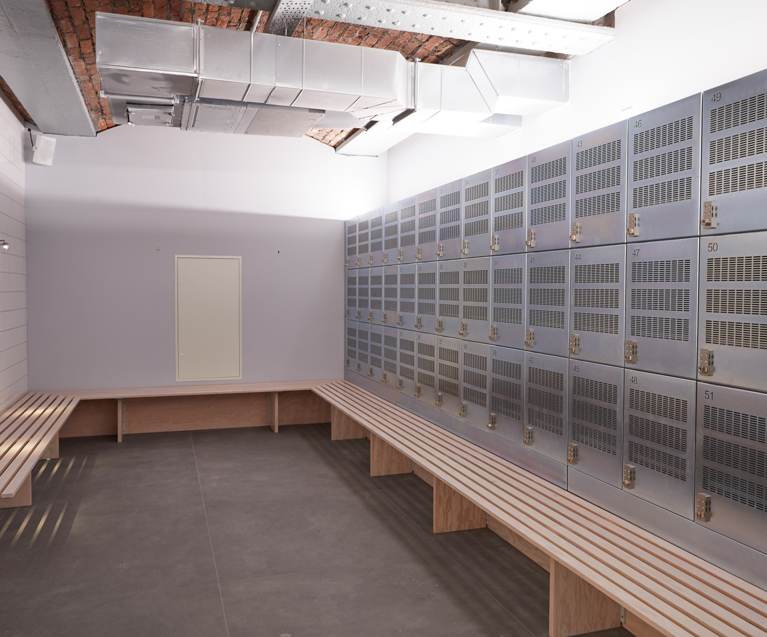 MALE CHANGING ROOM, Douglas fir slat built in benches. Lockers by Craftsman. 
