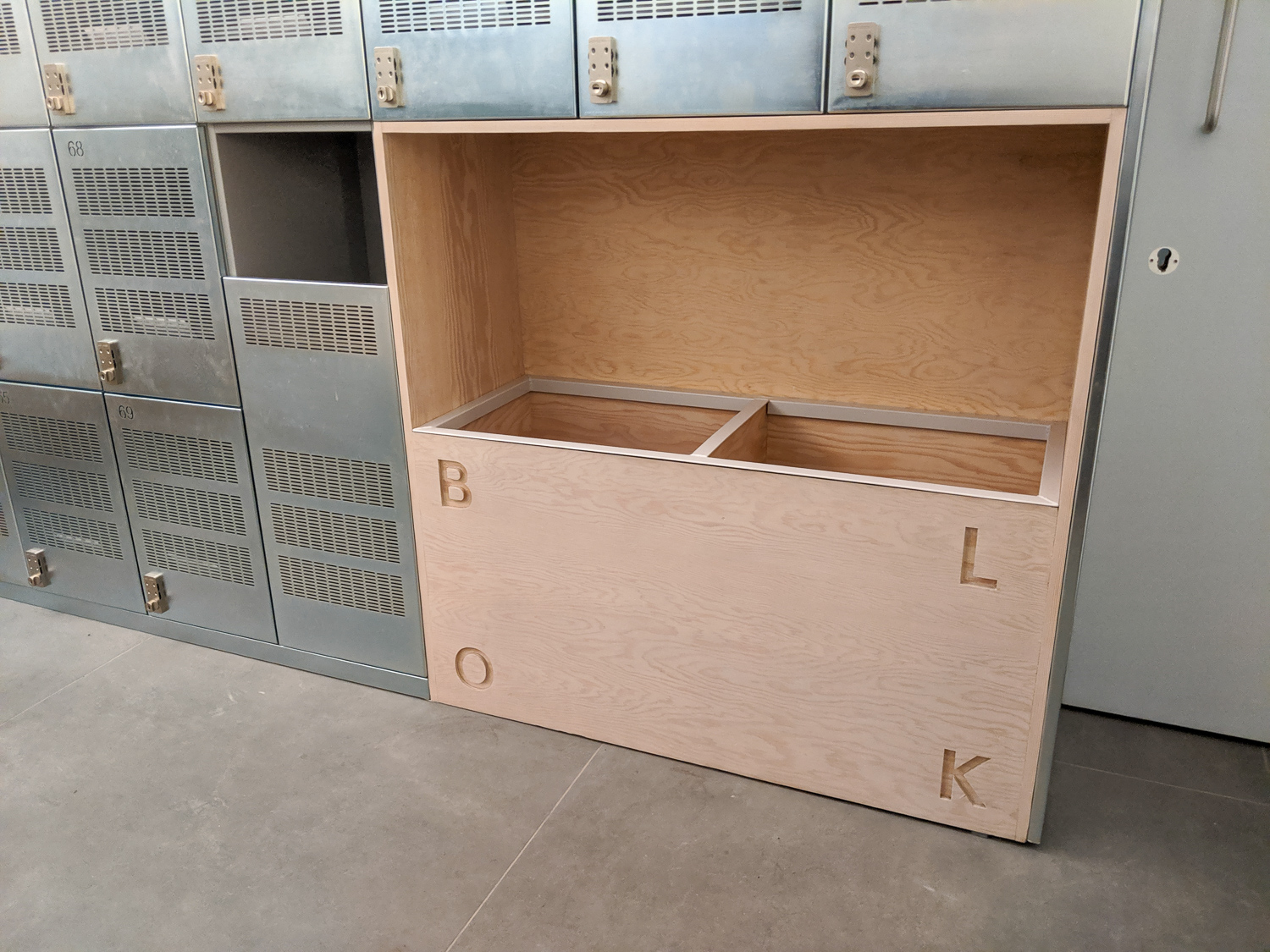 CHANGING ROOM TOWEL BINS, Douglas fir towel bins with custom metal inserts.
