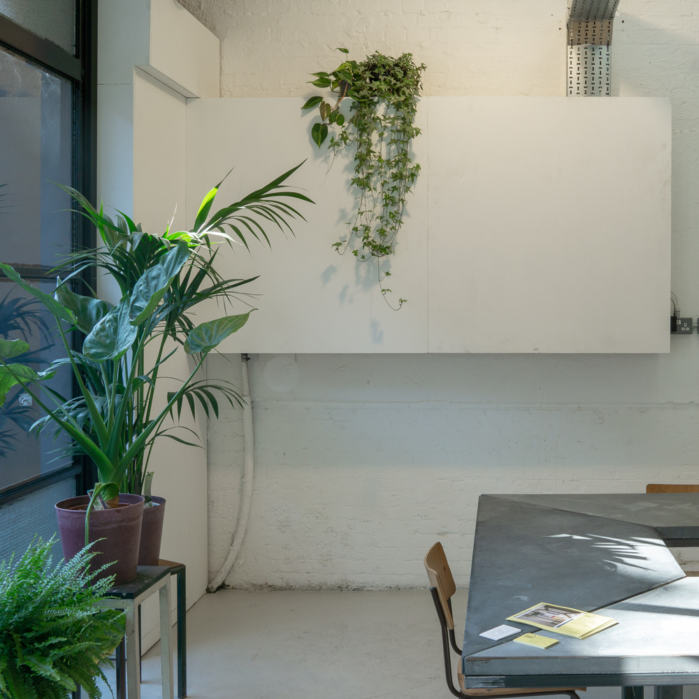 LOBBY INTERIOR, Cast concrete and mild steel table.
