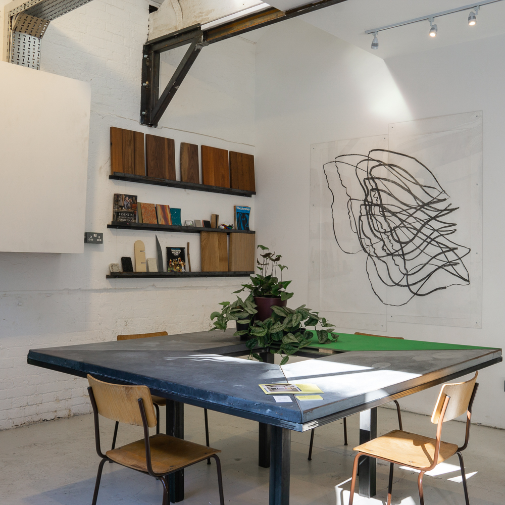 LOBBY INTERIOR, Cast concrete and mild steel table.
