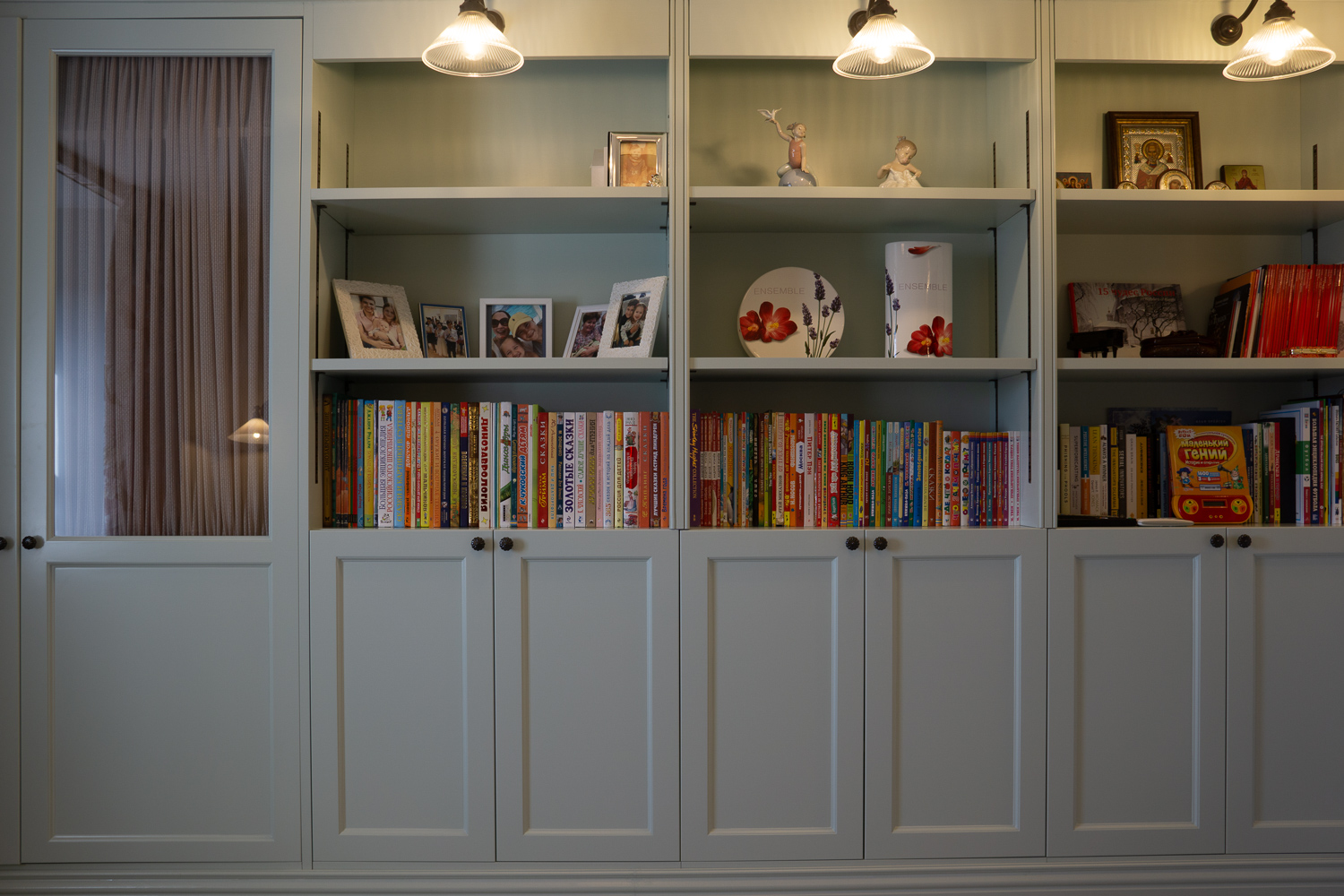 Wardrobe & shelving, Glass doored wardrobe with cabinets and shelves built around chimney breast.
