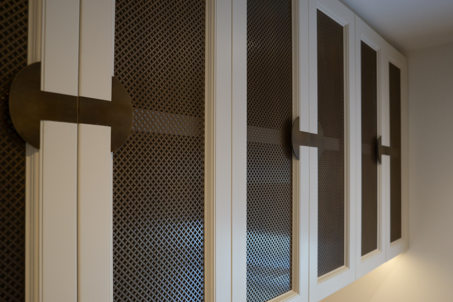 Desk Cabinets, Closeup of mesh and custom designed handles. 
