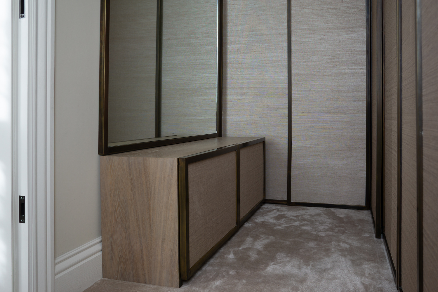 Shoe Storage & Mirror, Bespoke antique Brass mirror with hanging rail. Side view of wardrobe doors.
