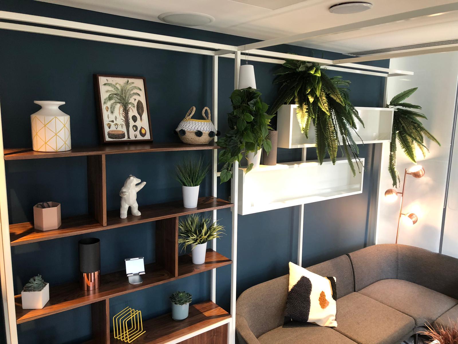 Green room, Mild steel powder coated integrated shelving support unit. Walnut cabinet with sliding doors. Wooden vitrine boxes.
