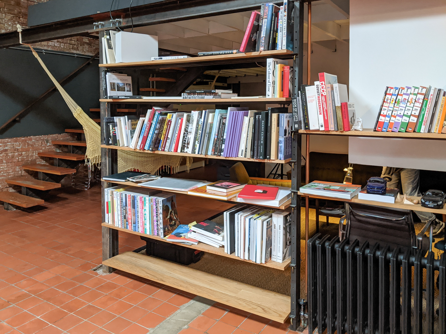 Key System Shelving, Solid oak shelves with steel undersupports. Bent brass key system for adjustments. Waxed mild steel.

