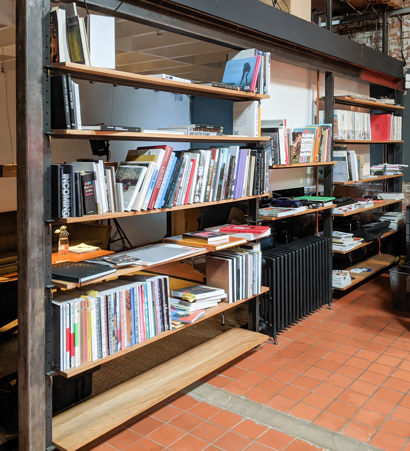 Key System Shelving, Solid oak shelves with steel undersupports. Bent brass key system for adjustments. Waxed mild steel.