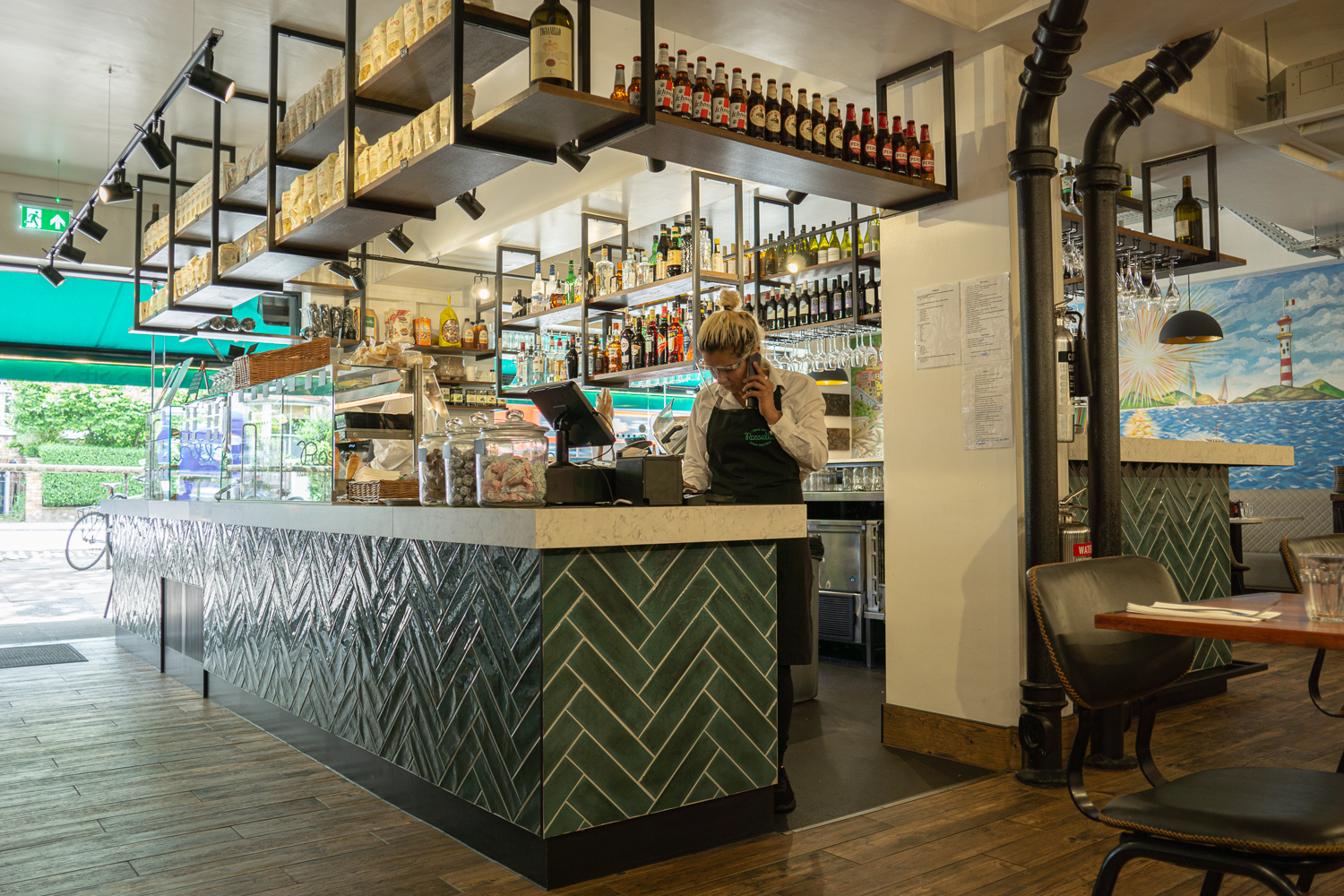 Deli Bar, Formica Aria worktops with drop edge. Bar frame, skirting and kick rail all powder coated mild steel. Gantries with stained oak shelves. 
