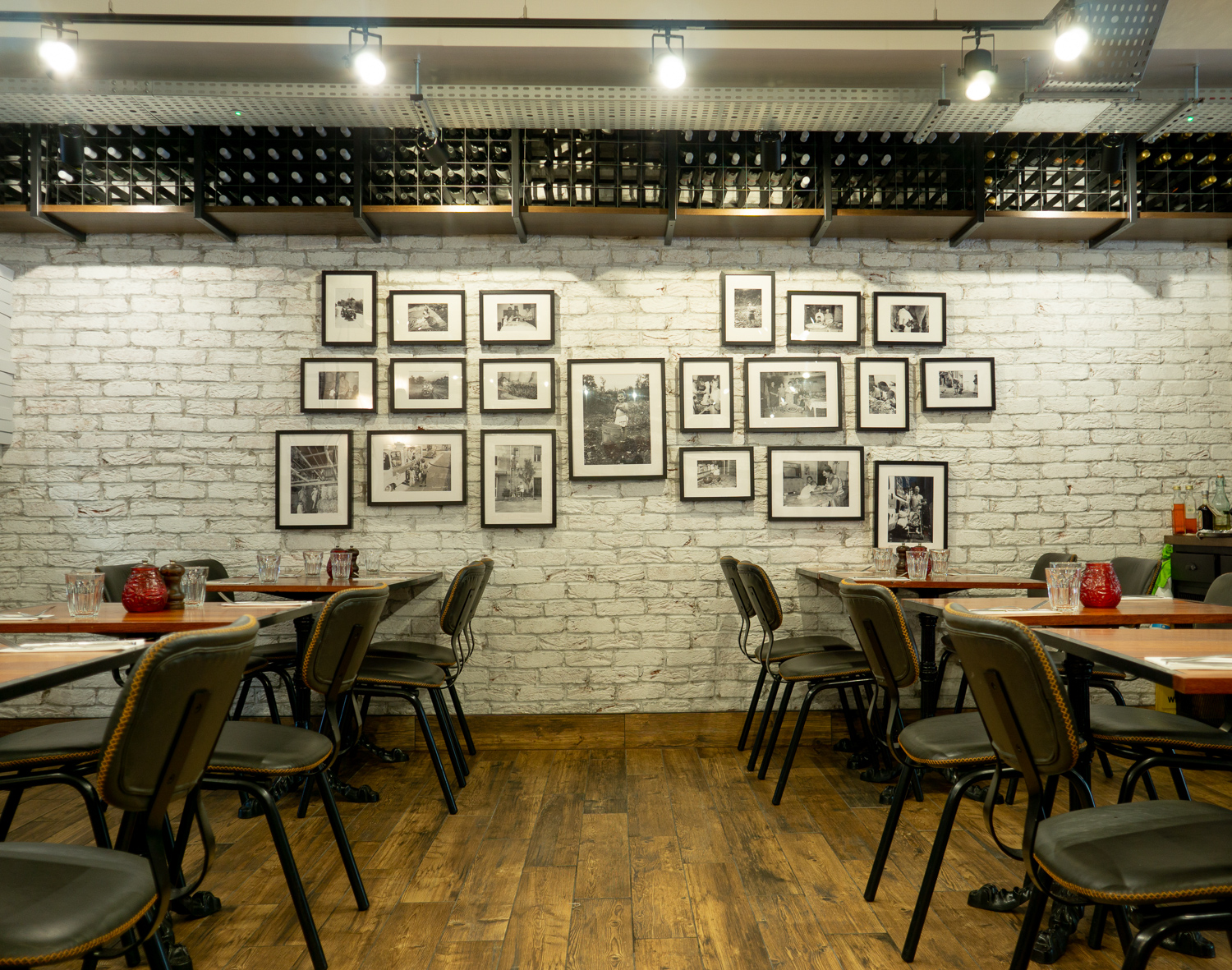 Photo Wall, Reclaimed shelves and hooks. Wine storage gantries.
