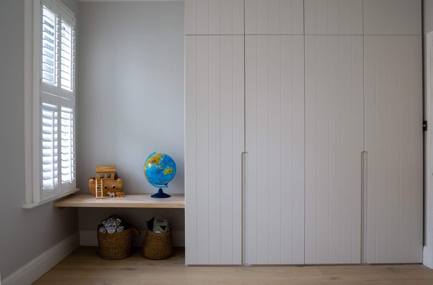 TENNYSON ROAD, Douglas Fir bench seat, cnc fronted wardrobes with routed pull handles for a child's bedroom.
