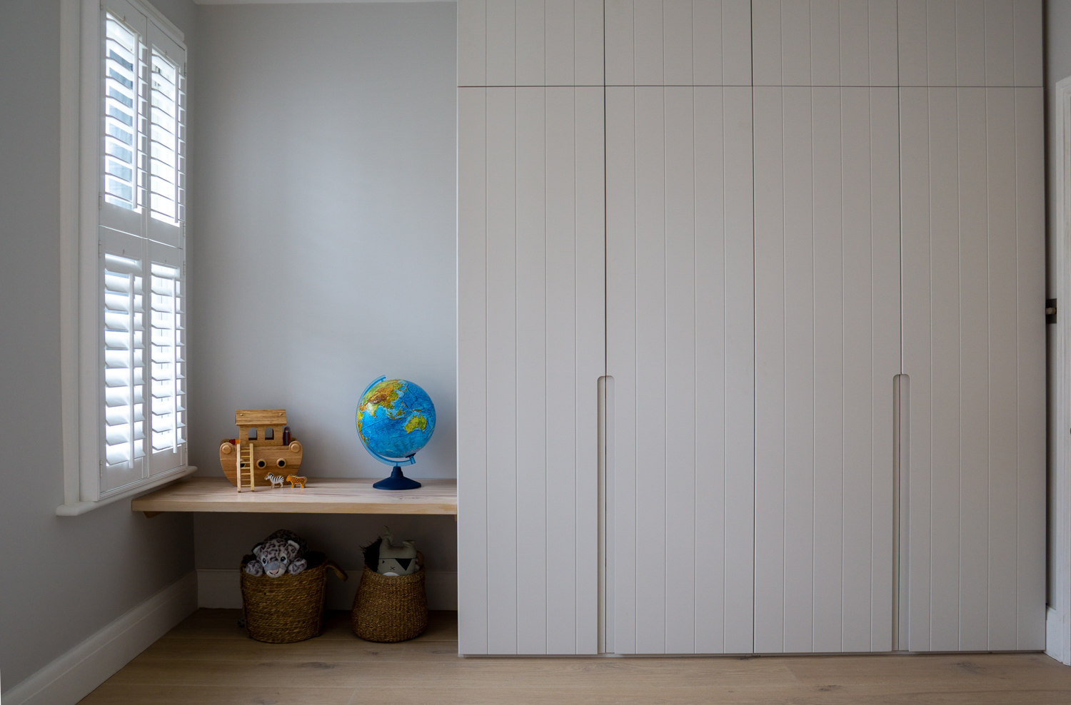 TENNYSON ROAD, Douglas Fir bench seat, cnc fronted wardrobes with routed pull handles for a child's bedroom.
