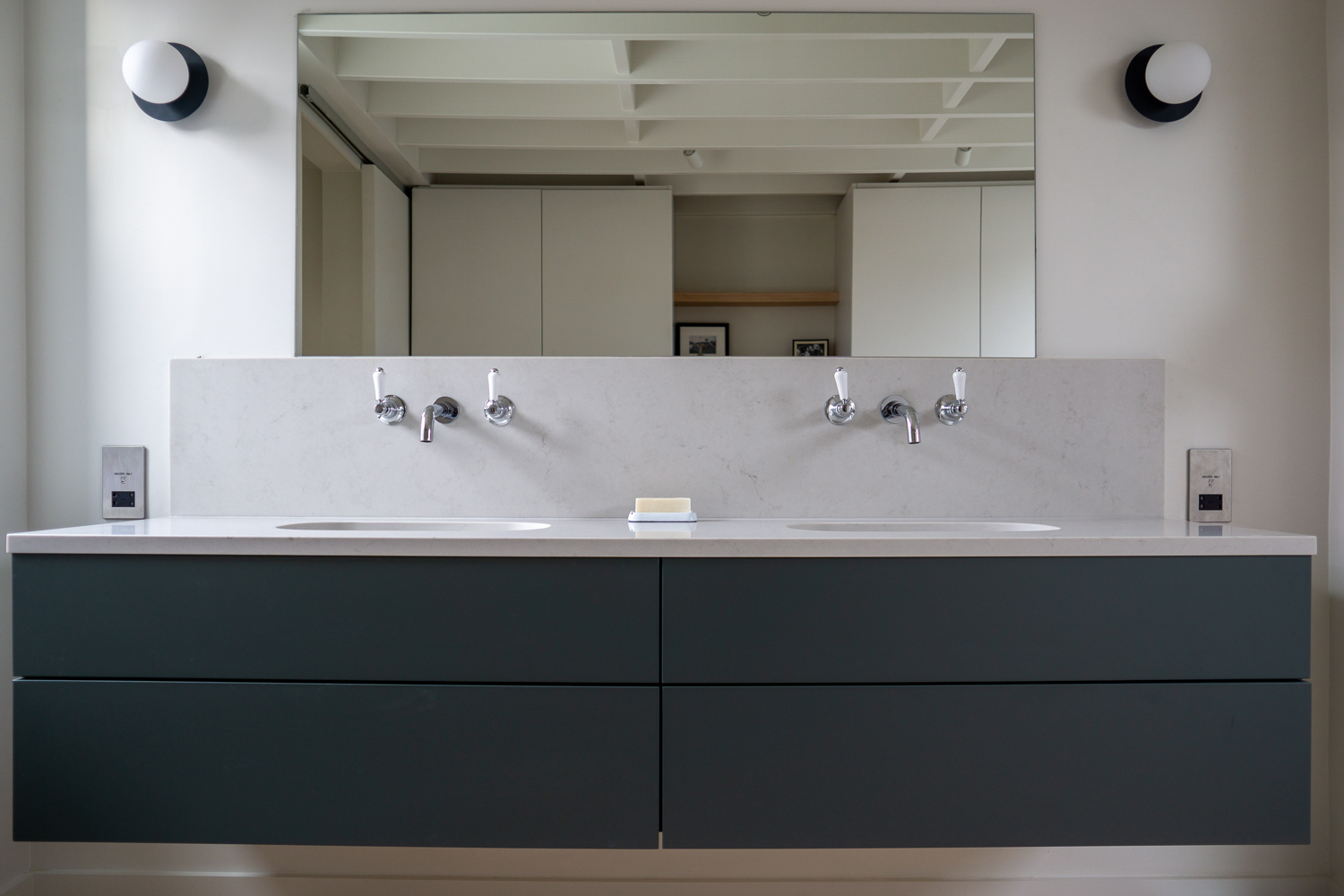 TENNYSON ROAD, Cesar Stone vanity mounted as floating countertop all drawers functional around plumbing
