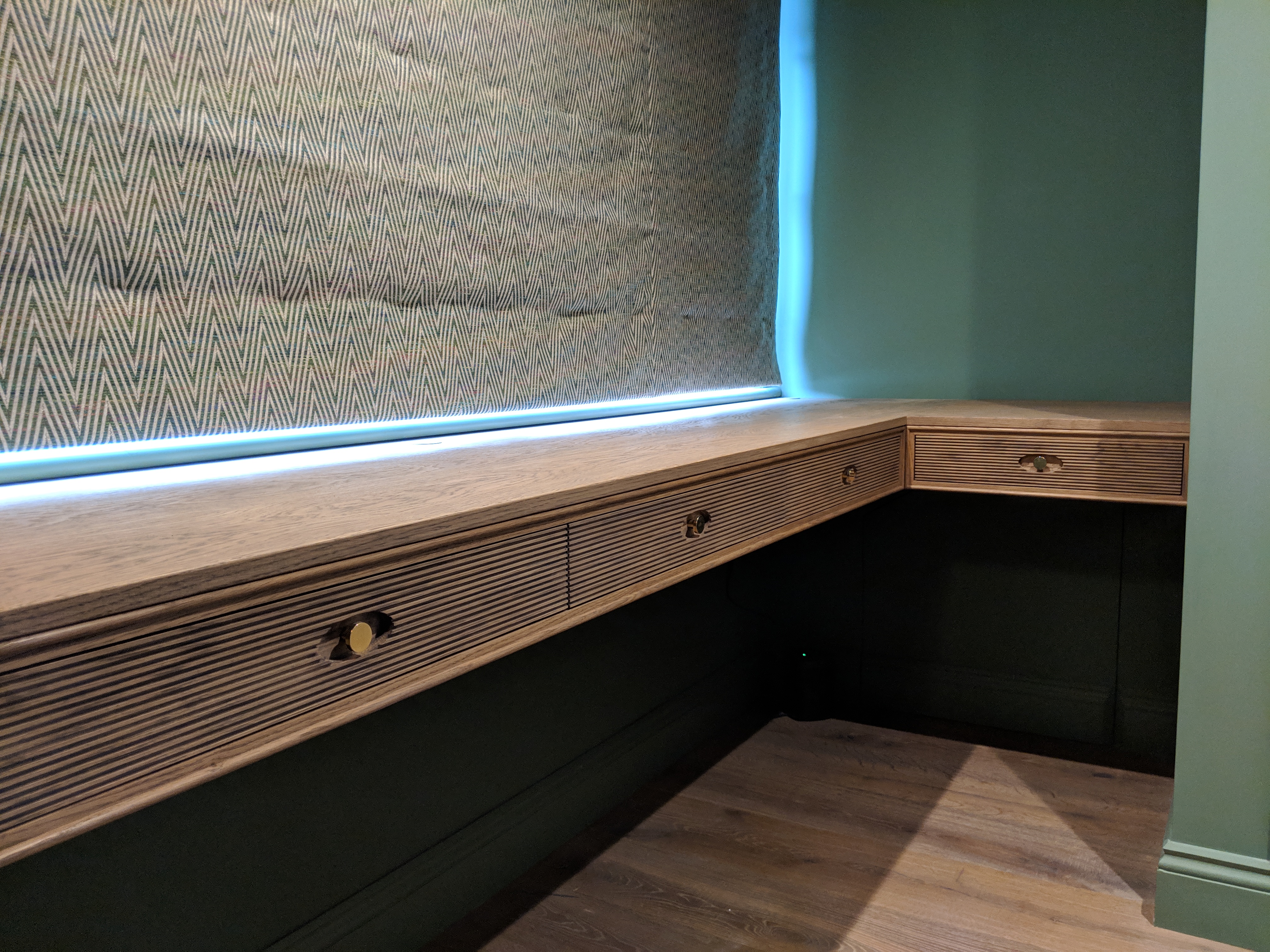 CORNER DESK, Brined oak with reeded drawer fronts.
