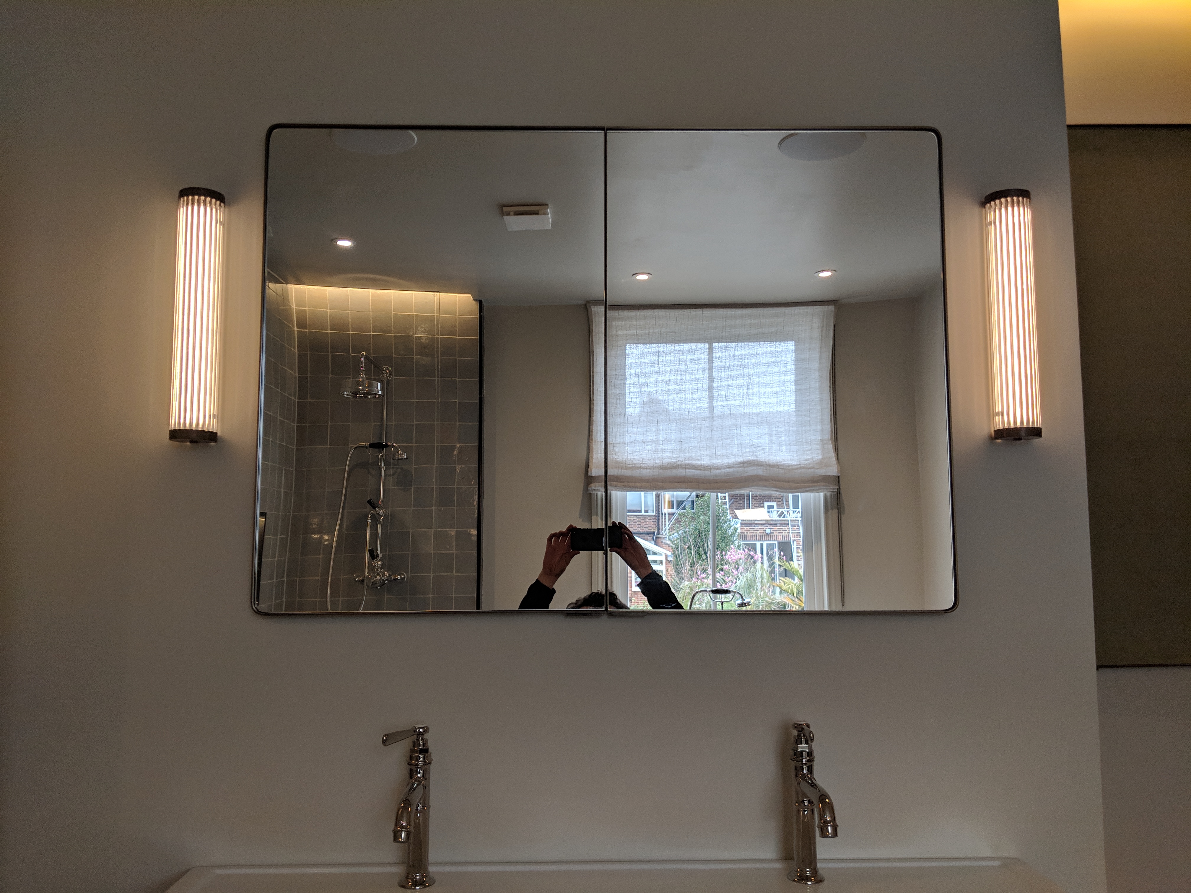 MEDICINE CABINET DETAIL, Bent steel and radius'd mirror detail.
